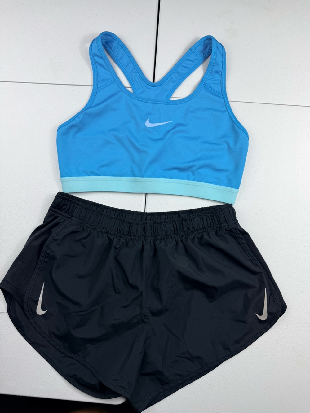 Nike Light Blue Racerback Sports Bra with Black Running Shorts